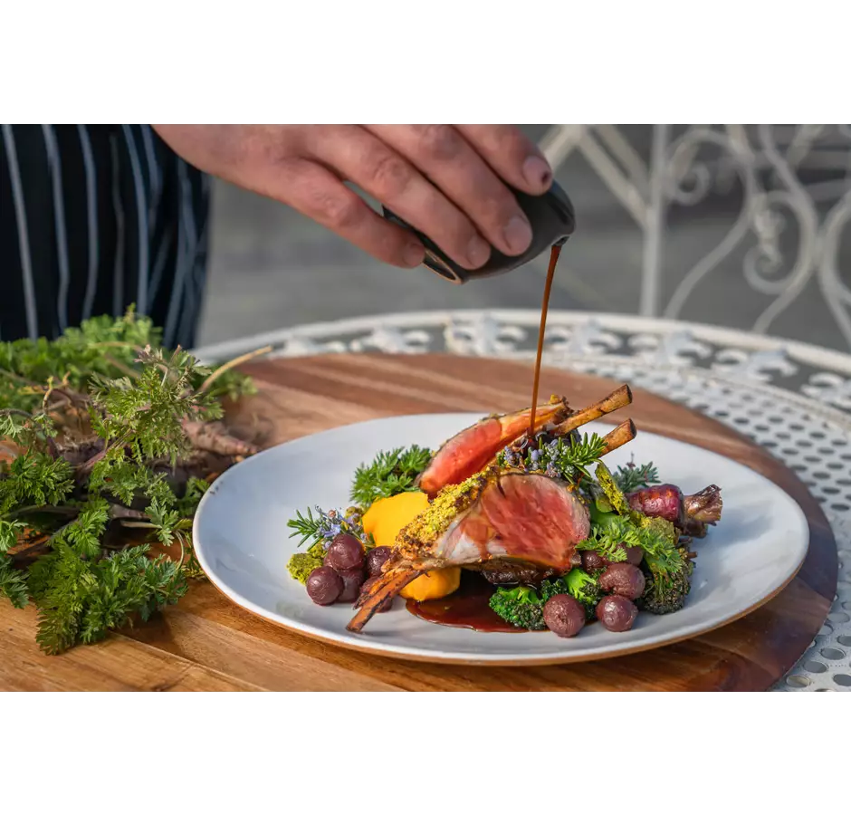 Plate of lamb cutlets and vegetables at the Lakeside Retreat in Mackenzie.