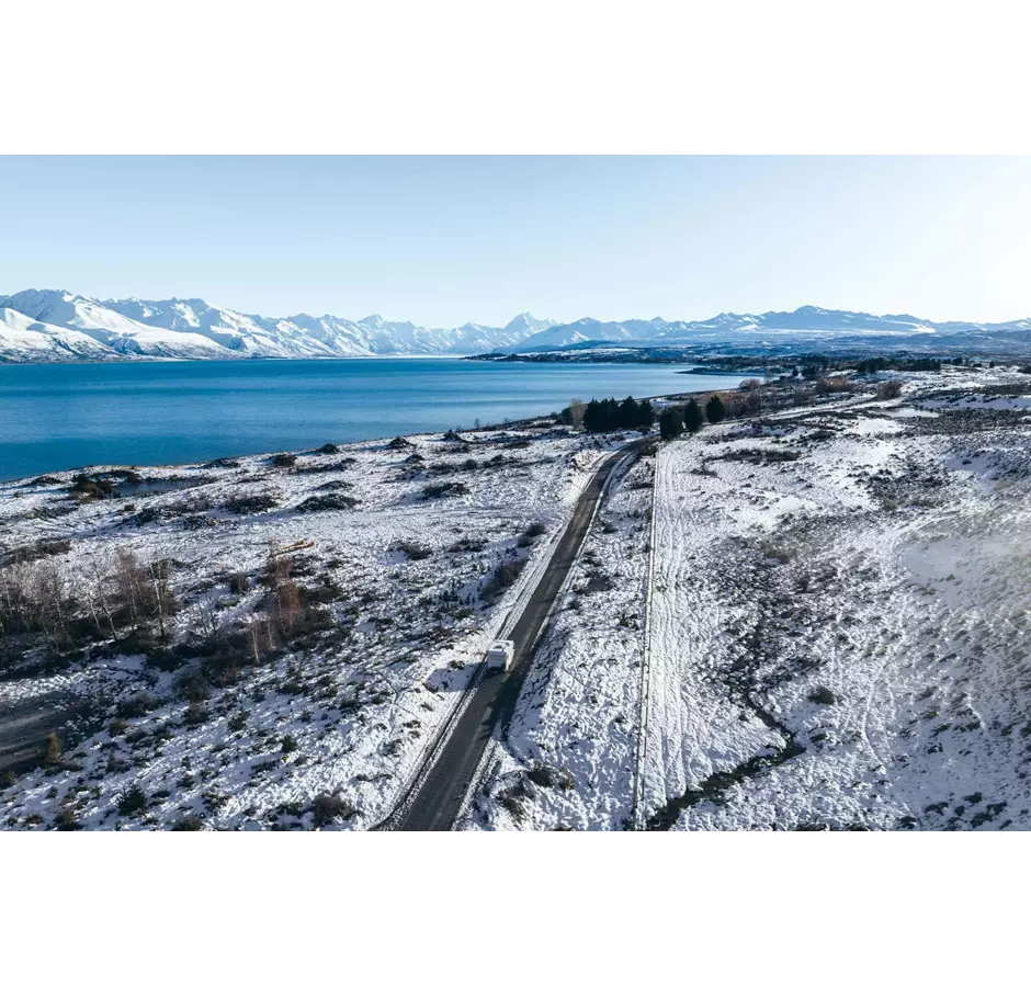 Camper Driving In Snow