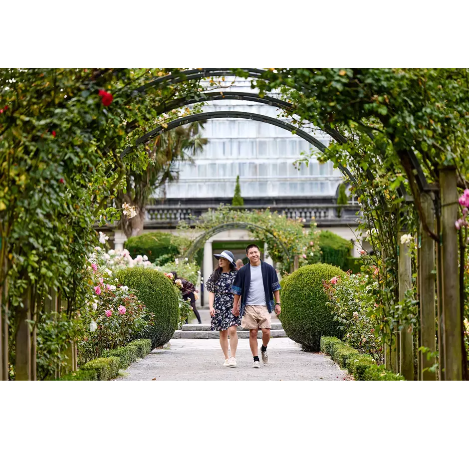 Couple Enjoying The Sceneries At The Rose Garden